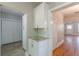 Hallway area showing tile floor entry to kitchen. Another doorway to a living room with hardwood floors is visible at 1967 West John Calvin Ave, Atlanta, GA 30337