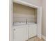 The dedicated laundry area features a washer and dryer with ample closet space for storage solutions at 1967 West John Calvin Ave, Atlanta, GA 30337