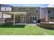 Spacious backyard with a covered patio, perfect for outdoor gatherings and relaxation at 2657 Cedar Pine Way, Atlanta, GA 30360