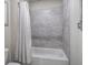 Bathroom featuring tiled walls and bathtub at 2657 Cedar Pine Way, Atlanta, GA 30360