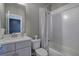Bathroom featuring modern fixtures, a tile shower, and plenty of space at 2657 Cedar Pine Way, Atlanta, GA 30360