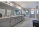 Bathroom with marble floors, double vanity, garden tub and decorative mirror at 2657 Cedar Pine Way, Atlanta, GA 30360