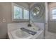 Bathroom featuring a soaking tub, candles, and a decorative mirror at 2657 Cedar Pine Way, Atlanta, GA 30360
