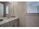 Bathroom featuring a gray vanity, a white quartz countertop, and a neutral color palette at 2657 Cedar Pine Way, Atlanta, GA 30360