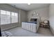 Bedroom with padded headboard, decorative chair and mirrors at 2657 Cedar Pine Way, Atlanta, GA 30360