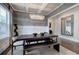 The dining room is decorated with a crystal chandelier and a large framed mirror at 2657 Cedar Pine Way, Atlanta, GA 30360