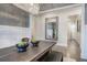 The stylish dining room table includes seating for six and a decorative wall mirror at 2657 Cedar Pine Way, Atlanta, GA 30360