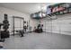 Spacious garage with overhead storage, work-out area, and clean epoxy flooring at 2657 Cedar Pine Way, Atlanta, GA 30360