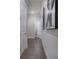 Hallway shows hardwood floors and white doors, with modern art adorning the walls and adding character at 2657 Cedar Pine Way, Atlanta, GA 30360