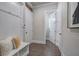 Hallway with built-in storage and a bench seat, offering practical organization and a welcoming entryway at 2657 Cedar Pine Way, Atlanta, GA 30360
