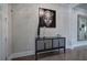 Stylish foyer featuring dark wood floors, statement artwork, and a chic console table for a grand entrance at 2657 Cedar Pine Way, Atlanta, GA 30360