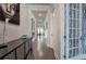 Elegant foyer with sleek console table, modern artwork, and hardwood floors leading into the open-concept living space at 2657 Cedar Pine Way, Atlanta, GA 30360