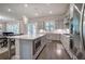 Open kitchen featuring a center island, stainless appliances, and custom cabinets at 2657 Cedar Pine Way, Atlanta, GA 30360