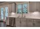 This gourmet kitchen includes stainless appliances, a subway tile backsplash, and custom cabinets at 2657 Cedar Pine Way, Atlanta, GA 30360