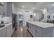 The open kitchen features stainless appliances, custom cabinets, and pantry at 2657 Cedar Pine Way, Atlanta, GA 30360
