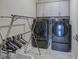Laundry room with washer, dryer, overhead cabinets and plenty of space at 2657 Cedar Pine Way, Atlanta, GA 30360