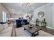 An open-concept living area features stylish furnishings and a seamless connection to the modern kitchen at 2657 Cedar Pine Way, Atlanta, GA 30360