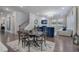 Open-concept living room featuring hardwood floors, a fireplace, recessed lighting, and a cozy seating area at 2657 Cedar Pine Way, Atlanta, GA 30360