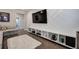 Loft area with built-in shelving, a large TV, and sports memorabilia at 2657 Cedar Pine Way, Atlanta, GA 30360
