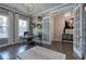 Bright home office with large windows, neutral decor, and elegant furnishings for a comfortable and productive work area at 2657 Cedar Pine Way, Atlanta, GA 30360