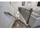 Wood stairs leading to the loft area with decorative railings at 2657 Cedar Pine Way, Atlanta, GA 30360