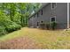 The home features a vast backyard that is surrounded by lush, mature trees that provide shade and privacy at 2865 Bryant Ct, Cumming, GA 30040