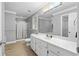 Bright bathroom features a double sink, shower, tub, and sleek, neutral color palette at 2865 Bryant Ct, Cumming, GA 30040