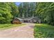 Charming single-story home with mature landscaping, a circular driveway, and a 2-car garage at 2865 Bryant Ct, Cumming, GA 30040
