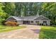 Charming ranch-style home with a well-maintained lawn and a circular driveway at 2865 Bryant Ct, Cumming, GA 30040