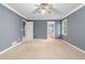 Spacious main bedroom with neutral carpet, walk-in closet, and ensuite bathroom at 2865 Bryant Ct, Cumming, GA 30040