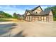 Long driveway leading to a spacious three-car garage, perfect for car enthusiasts and extra storage at 704 Rock Springs Rd, Lawrenceville, GA 30043