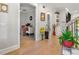 Well-lit hallway with wood flooring and views of the adjacent office and living spaces at 704 Rock Springs Rd, Lawrenceville, GA 30043
