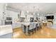 Well-appointed kitchen with island seating and stainless appliances, open to living area with lots of light at 704 Rock Springs Rd, Lawrenceville, GA 30043