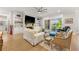 Bright living room boasts a fireplace, hardwood floors, built-in shelves, and access to the patio at 704 Rock Springs Rd, Lawrenceville, GA 30043