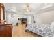 View of the main bedroom with tray ceiling, closet entrance, TV, and ceiling fan at 704 Rock Springs Rd, Lawrenceville, GA 30043