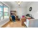 Bright home office with large windows, ample natural light, and functional workspace at 704 Rock Springs Rd, Lawrenceville, GA 30043