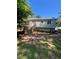 Back exterior view of the home features a deck, patio, and back entrance at 710 Singing Hills Ct, Roswell, GA 30076