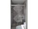 Modern bathroom featuring a walk-in shower with sliding glass doors and elegant tiling at 710 Singing Hills Ct, Roswell, GA 30076