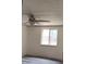 Bright bedroom featuring a ceiling fan, fresh paint, window, and modern flooring at 710 Singing Hills Ct, Roswell, GA 30076