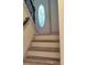 Cozy entryway featuring a decorative glass door and staircase with a black metal railing at 710 Singing Hills Ct, Roswell, GA 30076