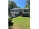 Well-maintained home with a front yard, attached garage, and a welcoming entrance at 710 Singing Hills Ct, Roswell, GA 30076