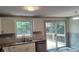 Bright kitchen with granite countertops, stainless steel appliances, and deck access at 710 Singing Hills Ct, Roswell, GA 30076