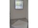 Empty room with grey floors and white walls, perfect for customization at 710 Singing Hills Ct, Roswell, GA 30076