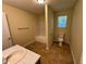 Bathroom featuring a tub, toilet, vanity, and neutral walls at 1050 Redan Trce, Stone Mountain, GA 30088