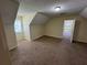 Cozy bedroom with sloped ceiling and neutral tones at 1050 Redan Trce, Stone Mountain, GA 30088