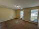 Cozy bedroom filled with natural light from two windows offers a comfortable retreat at 1050 Redan Trce, Stone Mountain, GA 30088