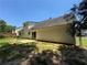 Exterior view of home with a sliding glass door and mature trees at 1050 Redan Trce, Stone Mountain, GA 30088