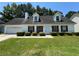 Charming one-story home with manicured lawn and mature trees creates a welcoming curb appeal at 1050 Redan Trce, Stone Mountain, GA 30088