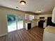 Functional kitchen with black appliances, ample cabinet space, and a sliding door for easy access at 1050 Redan Trce, Stone Mountain, GA 30088