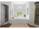 Bathroom features a soaking tub, stained glass window, and separate shower at 1050 Shady Valley Pl, Atlanta, GA 30324